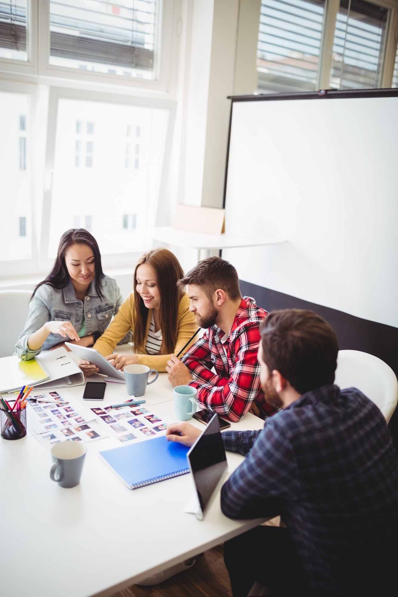 photo-editors-with-digital-tablet-in-meeting-room.jpg